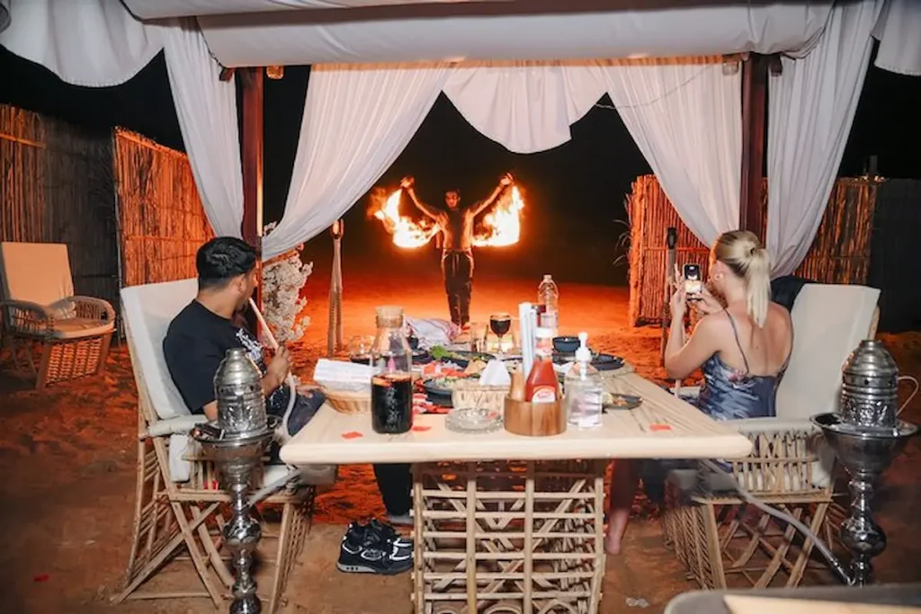 Overnight Dubai desert stay with private tent, sunset camel ride, BBQ dinner, and stunning golden dunes.