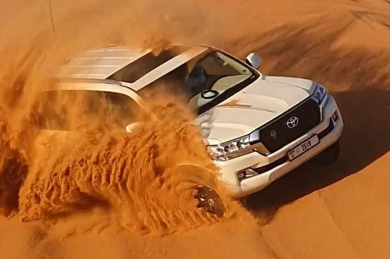 Premium 4x4 vehicle and upscale desert camp setup during a Dubai premium desert safari tour