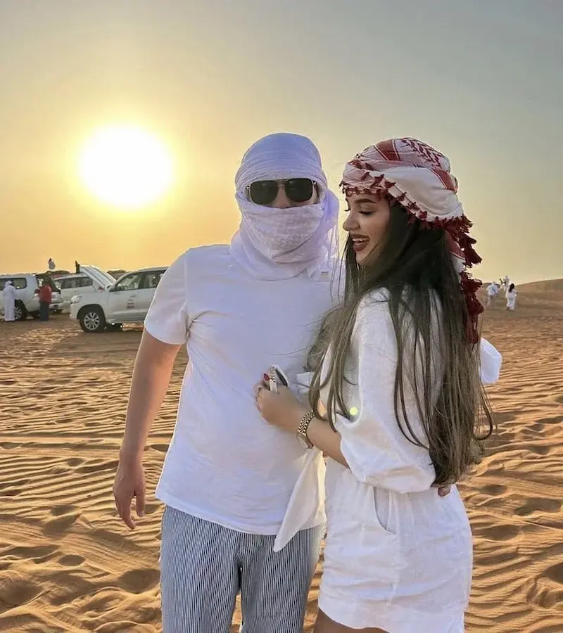 Photographer capturing dune landscape shots during a sunrise desert safari in Dubai