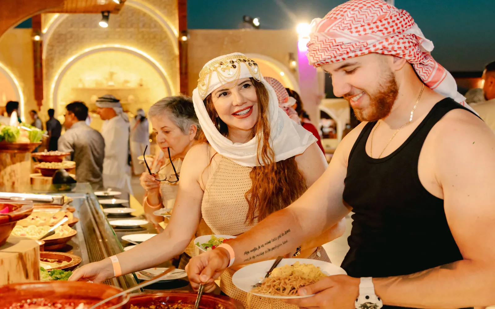 Traditional Arabian BBQ dinner setup at a premium Dubai desert safari camp